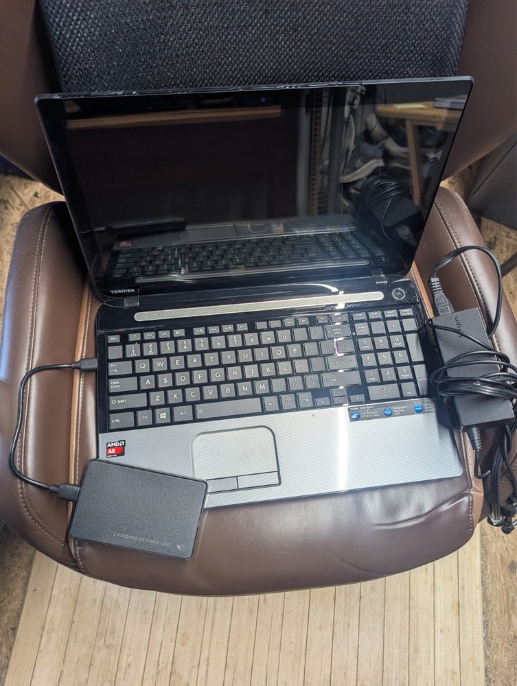 Mechanic automotive auto repair diagnostic software and wire diagrams on laptop